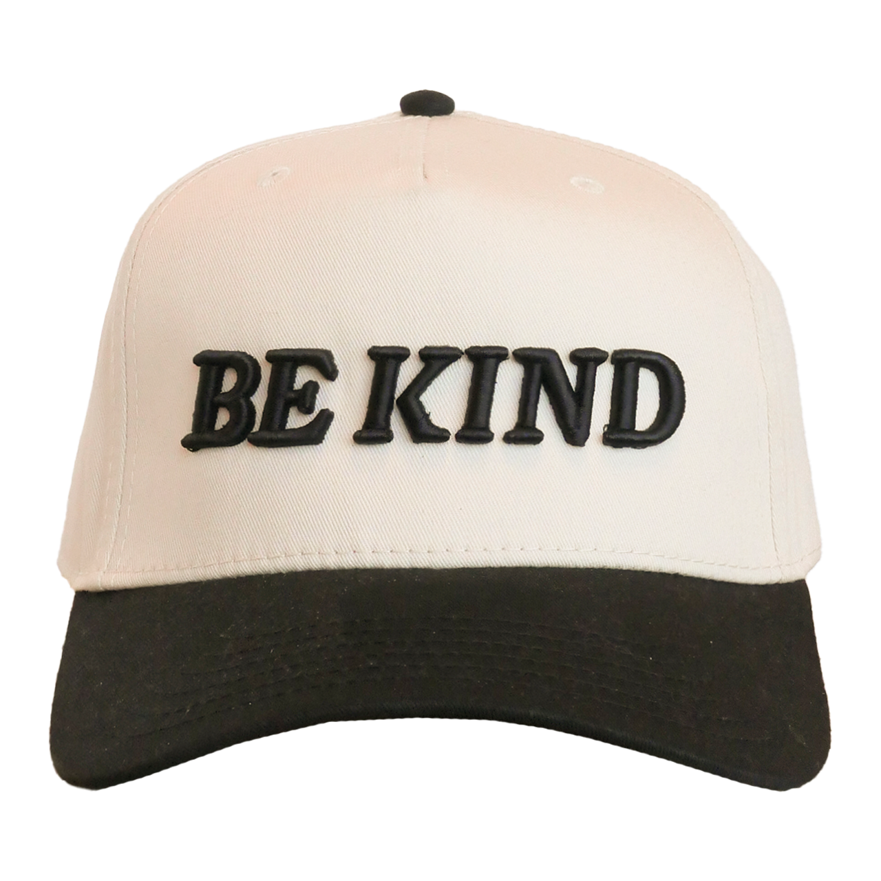 Beige and black cap with 'BE KIND' text on a white background