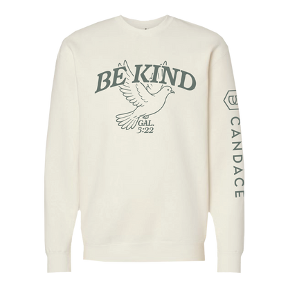 White sweatshirt with 'BE KIND' text and dove graphic on a white background