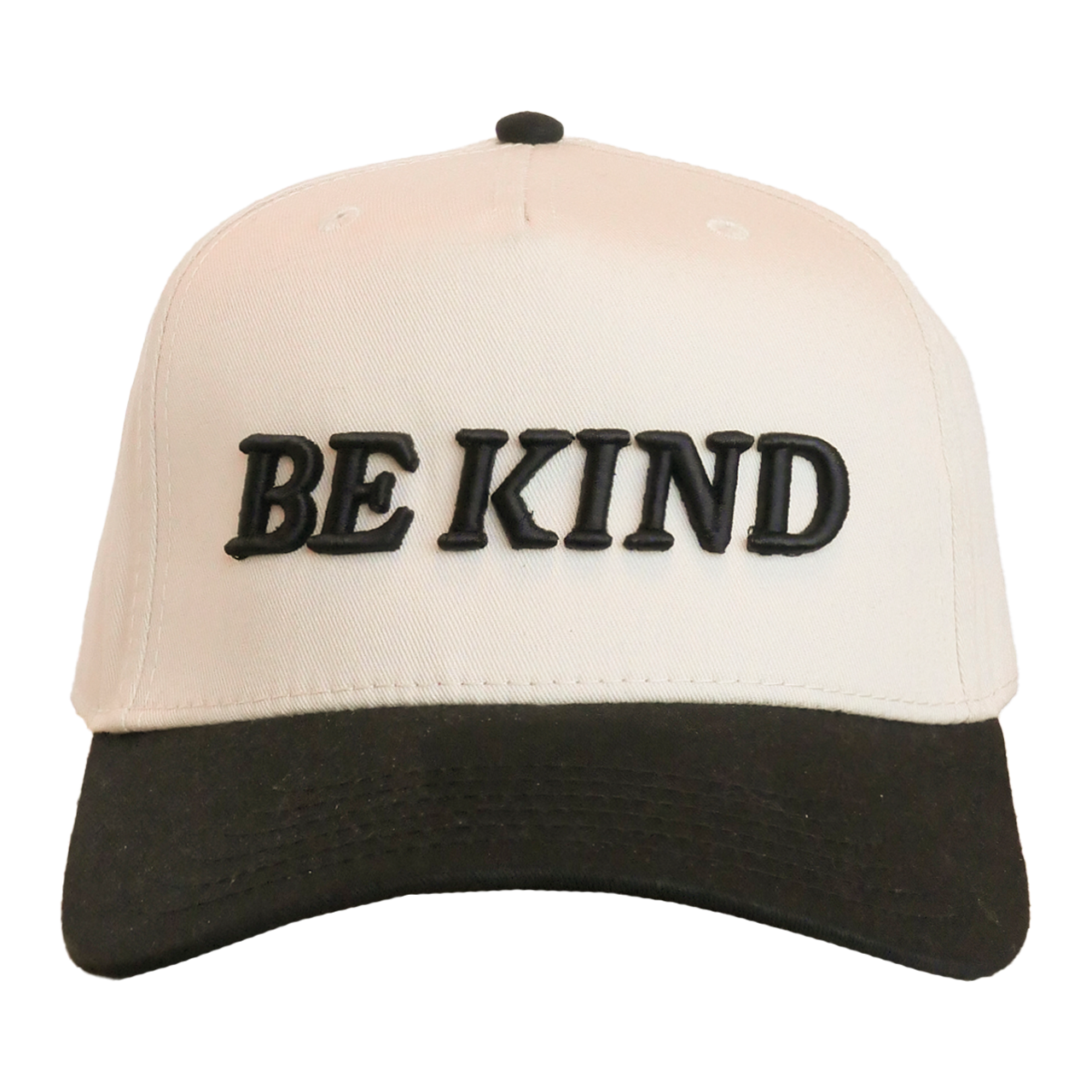 Beige and black cap with 'BE KIND' text on a white background