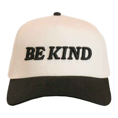 Beige and black cap with 'BE KIND' text on a white background